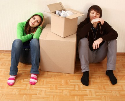Moving boxes and furniture prepared for a Twickenham home relocation