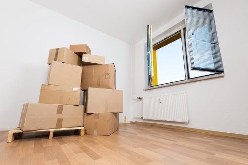 Moving van and boxes prepared for a residential relocation service