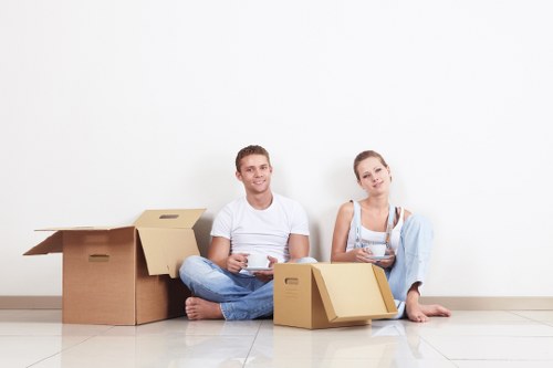 Packed moving boxes and furniture ready for transport in Twickenham